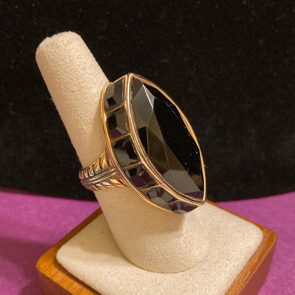 Akkad stamped large oval black faceted statement ring in gold tone